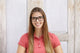 indoor-shot-beautiful-young-caucasian-female-wearing-polo-shirt-rectangular-glasses-smiling-happily-while-posing-isolated_273609-1875 - BioTurmric