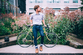 mens-fashion-man-in-shirt-and-jeans-leaning-on-bicycle - BioTurmric